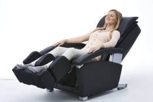 Client sitting and relaxing at a massage chair